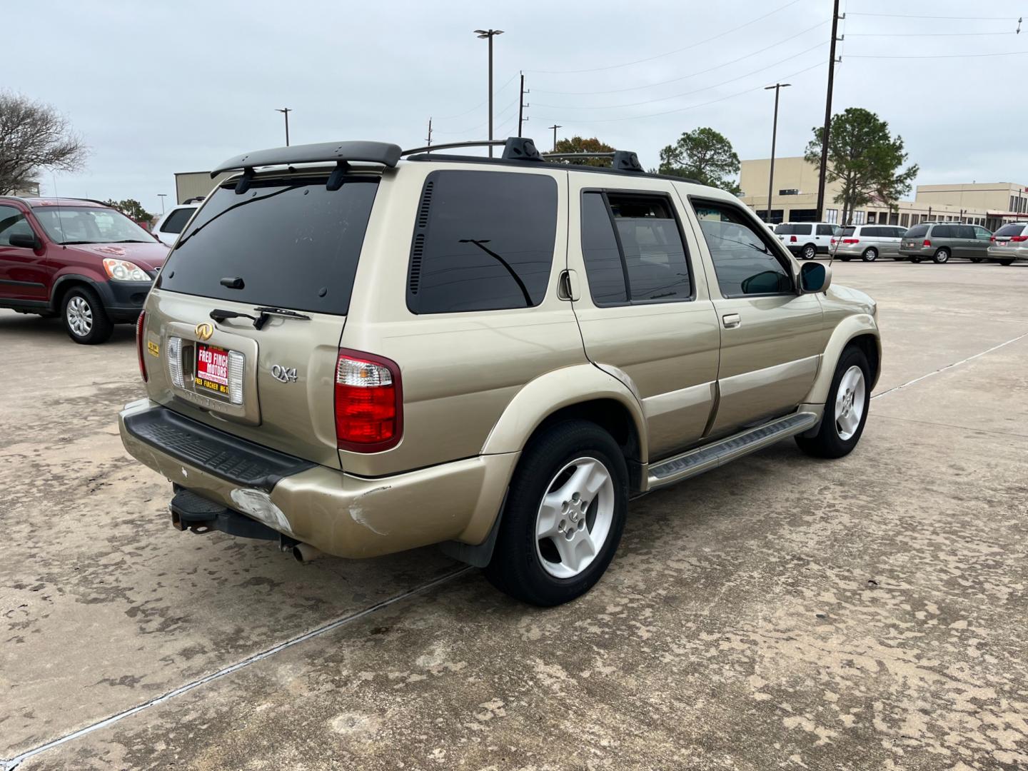 2003 tan /TAN Infiniti QX4 4WD (JNRDR09Y53W) with an 5 engine, 4-Speed Automatic Overdrive transmission, located at 14700 Tomball Parkway 249, Houston, TX, 77086, (281) 444-2200, 29.928619, -95.504074 - Photo#6